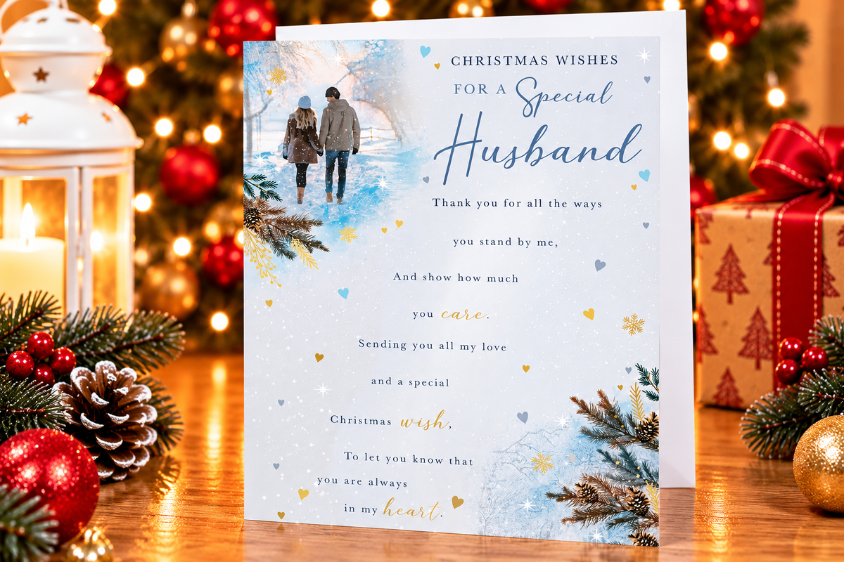Special Husband Christmas card displayed on festive table with candle lantern