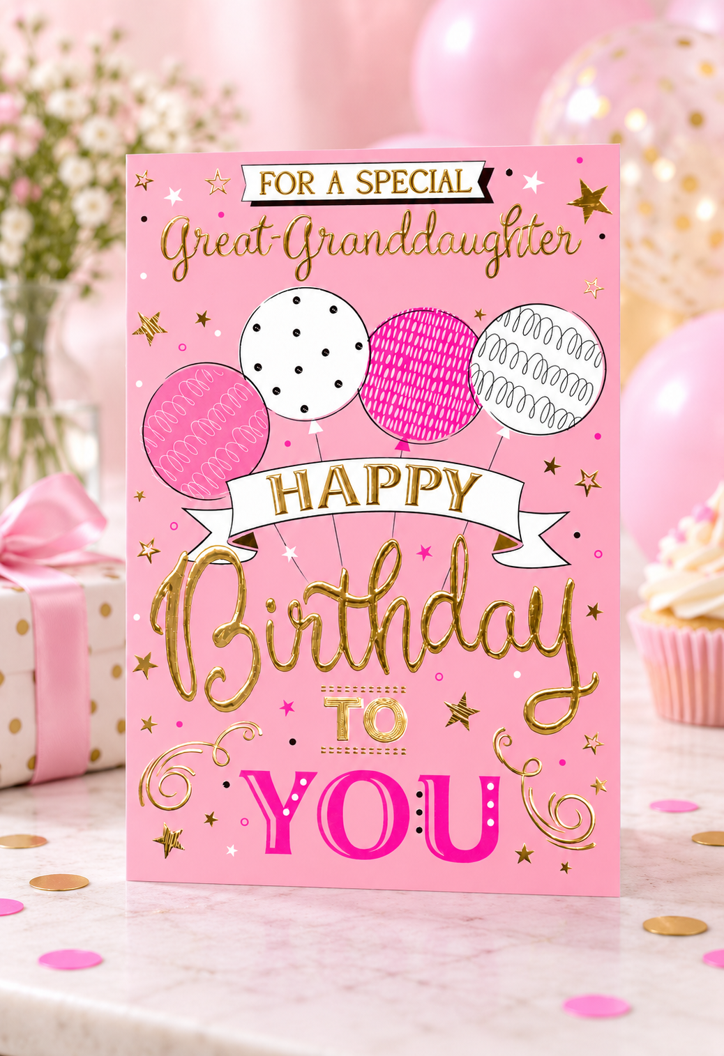 Lifestyle photo of the pink Great Granddaughter birthday card with balloons and gold foil
