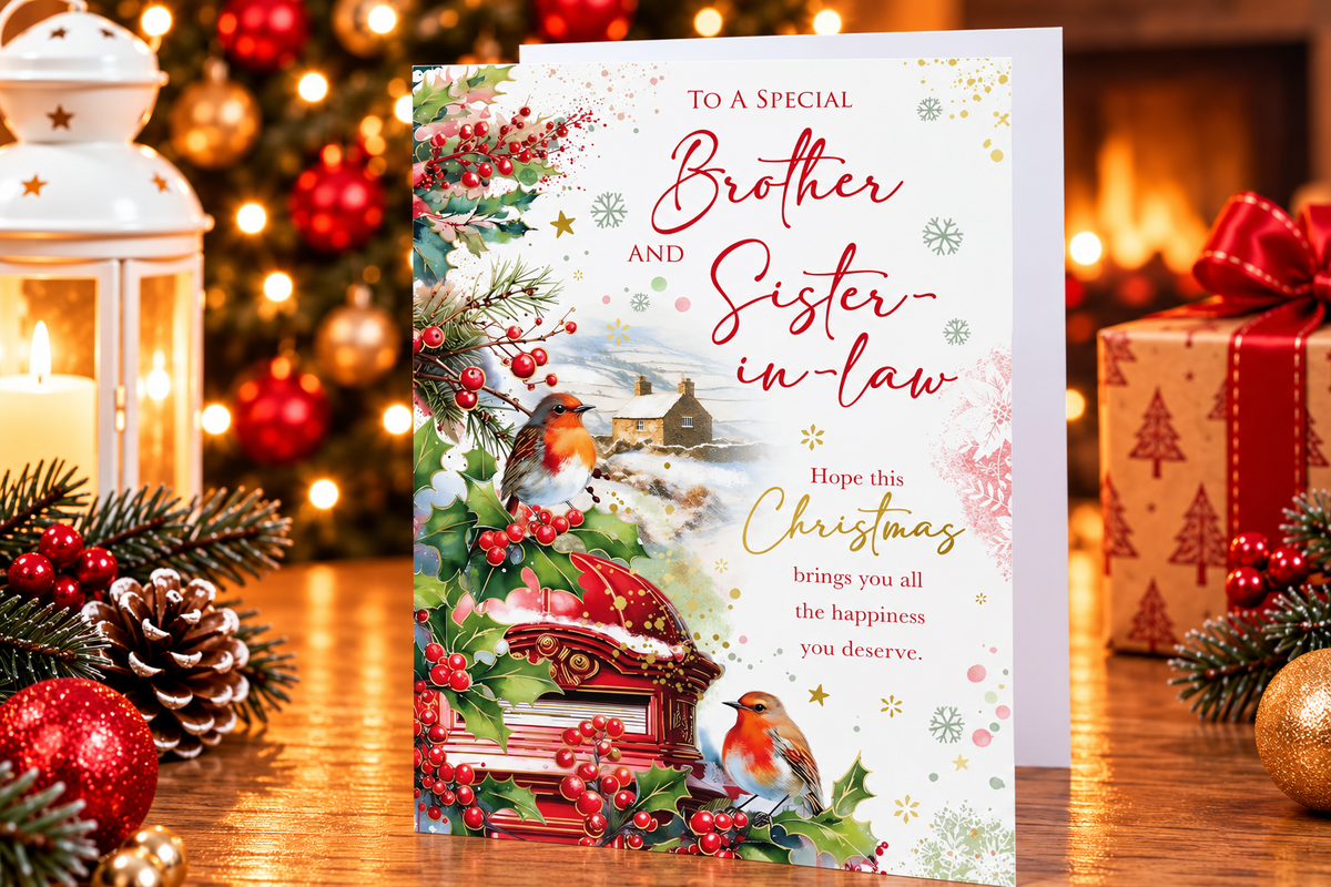 Kingfisher Brother and Sister-in-law Christmas card displayed beside Christmas decorations