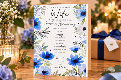 Sapphire Anniversary card for Wife displayed on a table with flowers and candles
