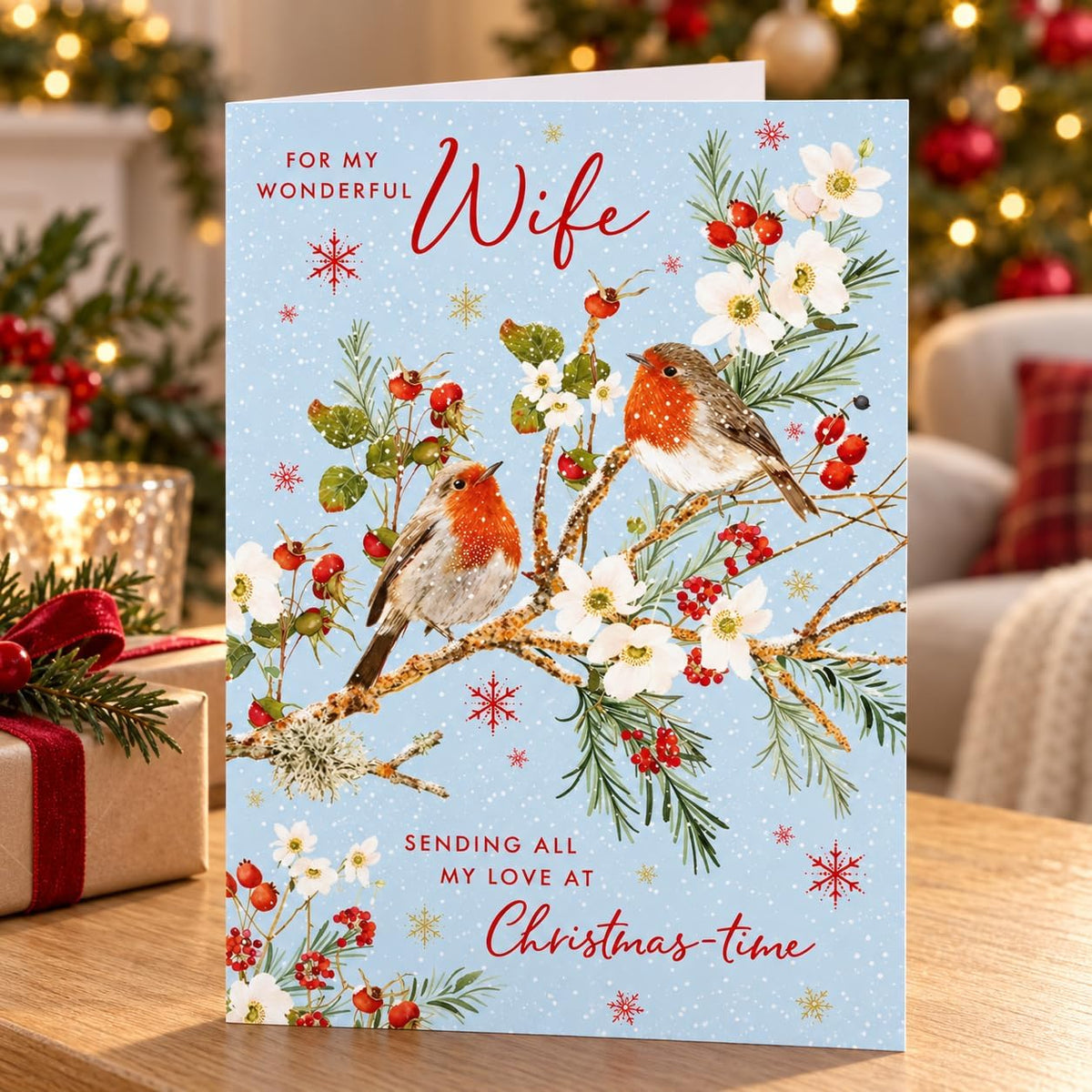 Front of Nigel Quiney Wonderful Wife Christmas card with two robins, winter flowers and berries