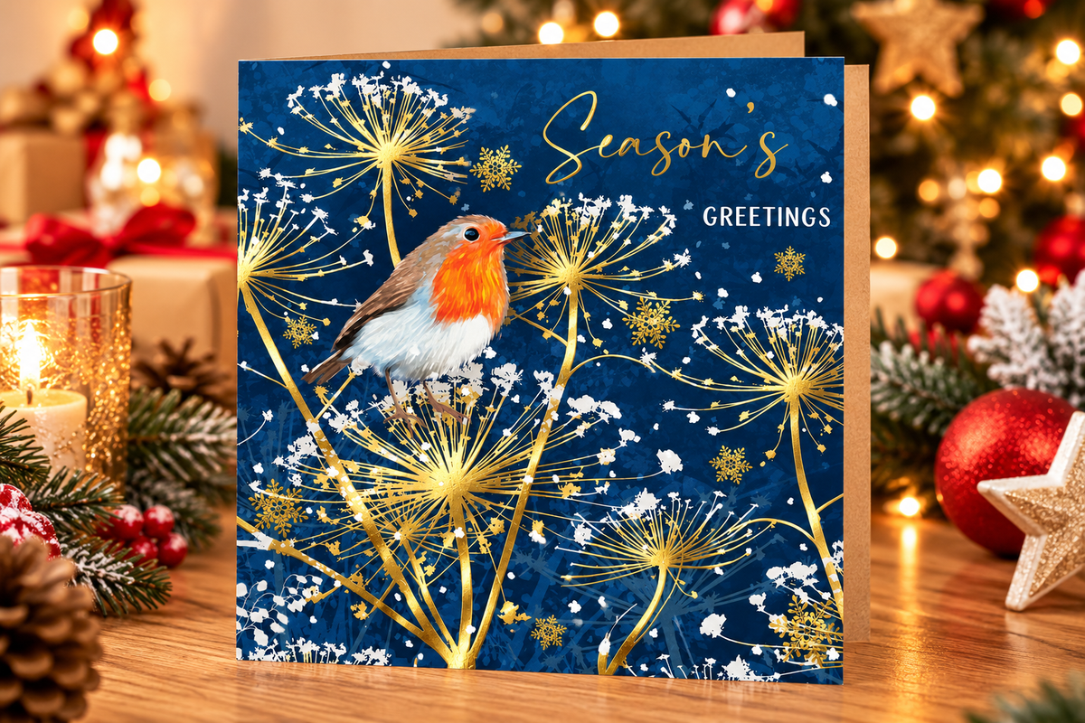 Nigel Quiney robin Christmas greeting card displayed on a festive table