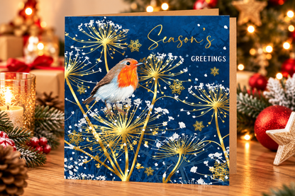 Nigel Quiney robin Christmas greeting card displayed on a festive table