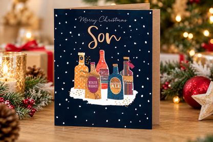 Son Christmas card by Otter House displayed in festive home setting with Christmas decorations