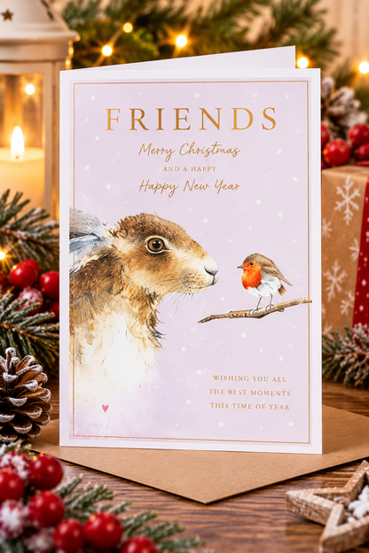 Friends Christmas card with hare and robin displayed among Christmas decorations