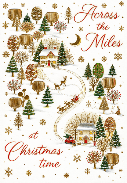 Abacus Across the Miles Christmas card with snowy village scene and gold detailing, 151 x 228mm
