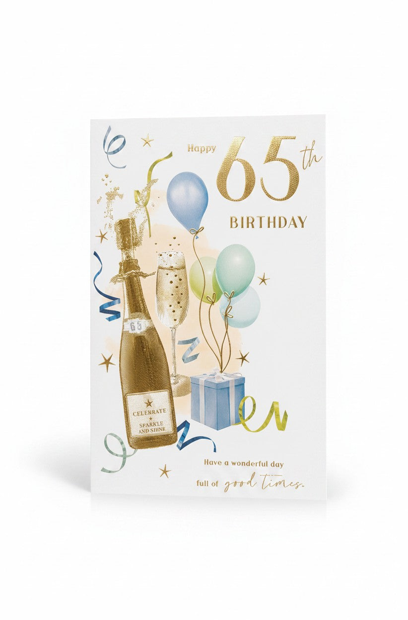 Made To Be Treasured 65th birthday card with champagne bottle, glass, balloons, and gift. Gold lettering.