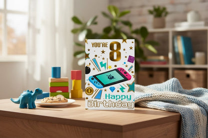 Made To Be Treasured 8th birthday card featuring a colourful gaming console design and You’re 8 Happy Birthday text.