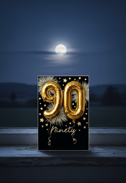 Made To Be Treasured Abacus 90th birthday card with gold foil balloon numbers on a black background with stars.