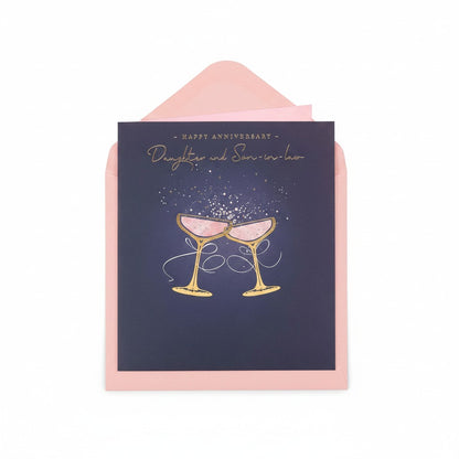 Made To Be Treasured anniversary card for daughter and son-in-law with gold foil champagne glasses on navy blue.