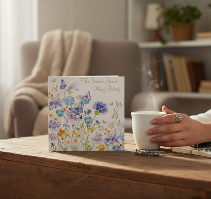 Made To Be Treasured 'For Someone Special' birthday card with blue allium flowers, daisies, and butterflies, gold foil details. Recyclable.
