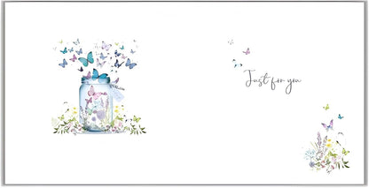 Made To Be Treasured 'Happy Birthday' card with butterfly jar illustration and silver foil finish. Features butterflies escaping a jar with floral accents.