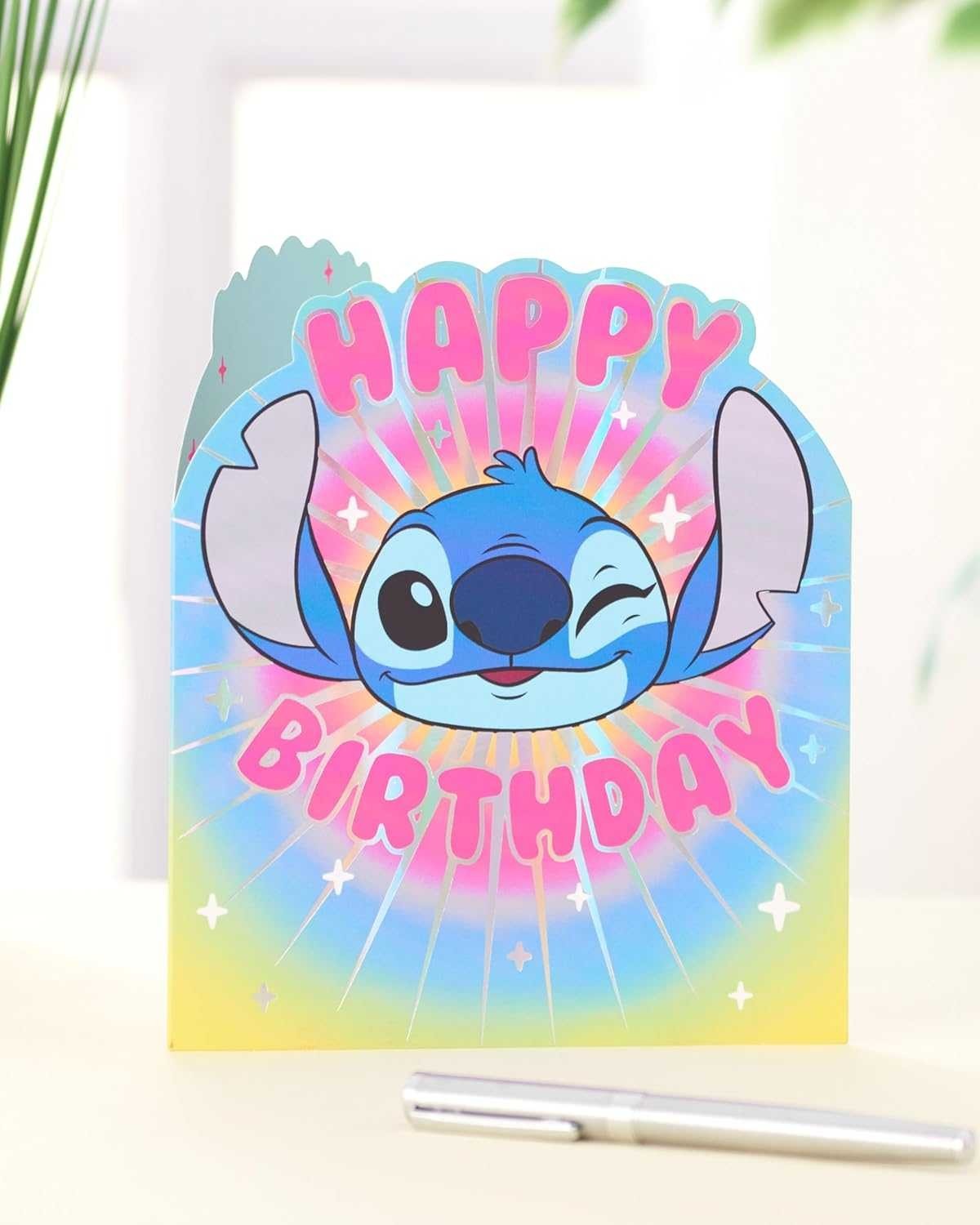 Made To Be Treasured Disney Stitch shaped birthday card with pink text on a colourful rainbow background.