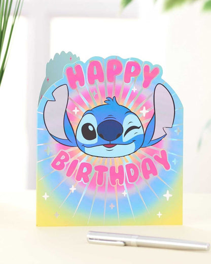 Made To Be Treasured Disney Stitch shaped birthday card with pink text on a colourful rainbow background.