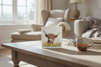 Made To Be Treasured Tracks Publishing blank greeting card featuring a Highland cow illustration with colourful wildflowers