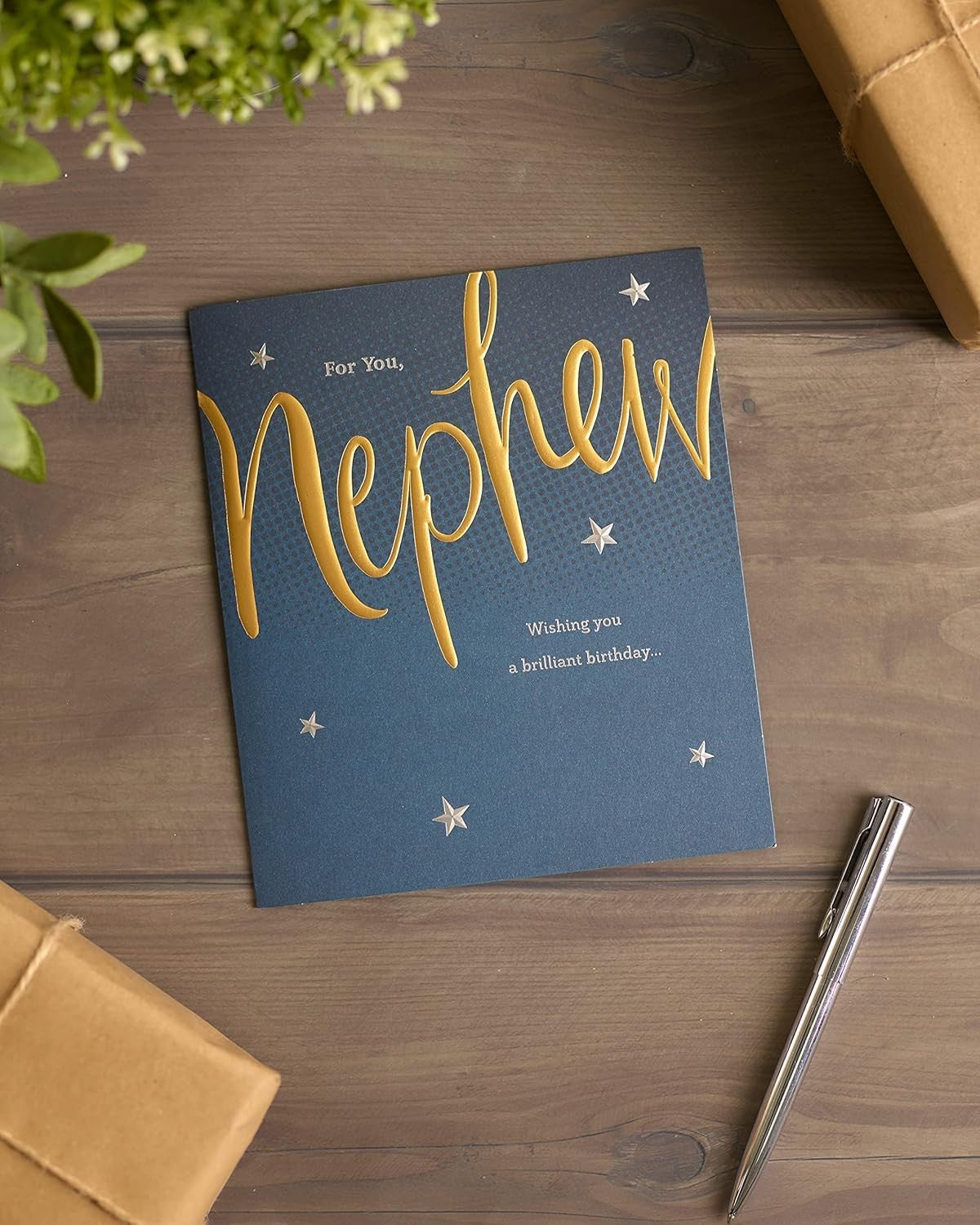 Made To Be Treasured nephew birthday card with navy blue background, gold foil text and silver stars.