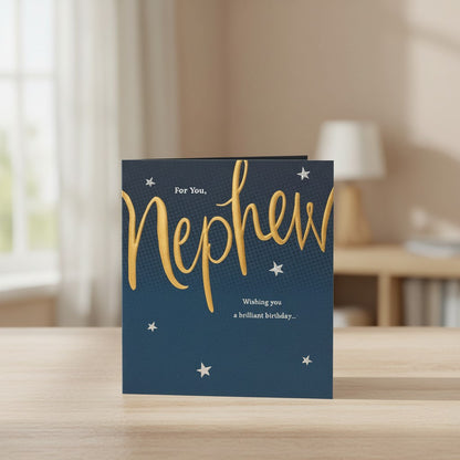 Made To Be Treasured nephew birthday card with navy blue background, gold foil text, and silver stars. Features