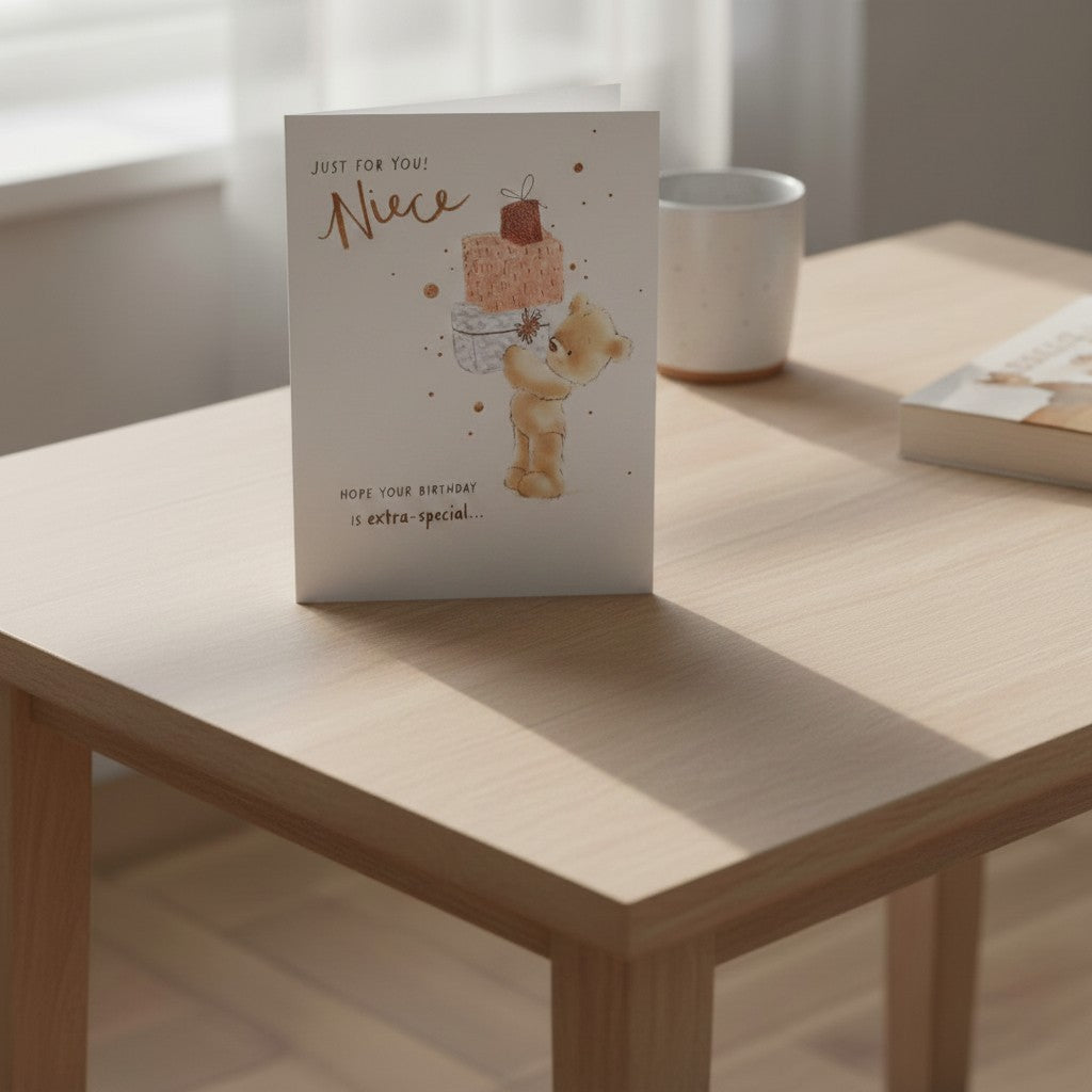 Made To Be Treasured niece birthday card with teddy bear and gifts, featuring watercolor illustration and gold foil text.