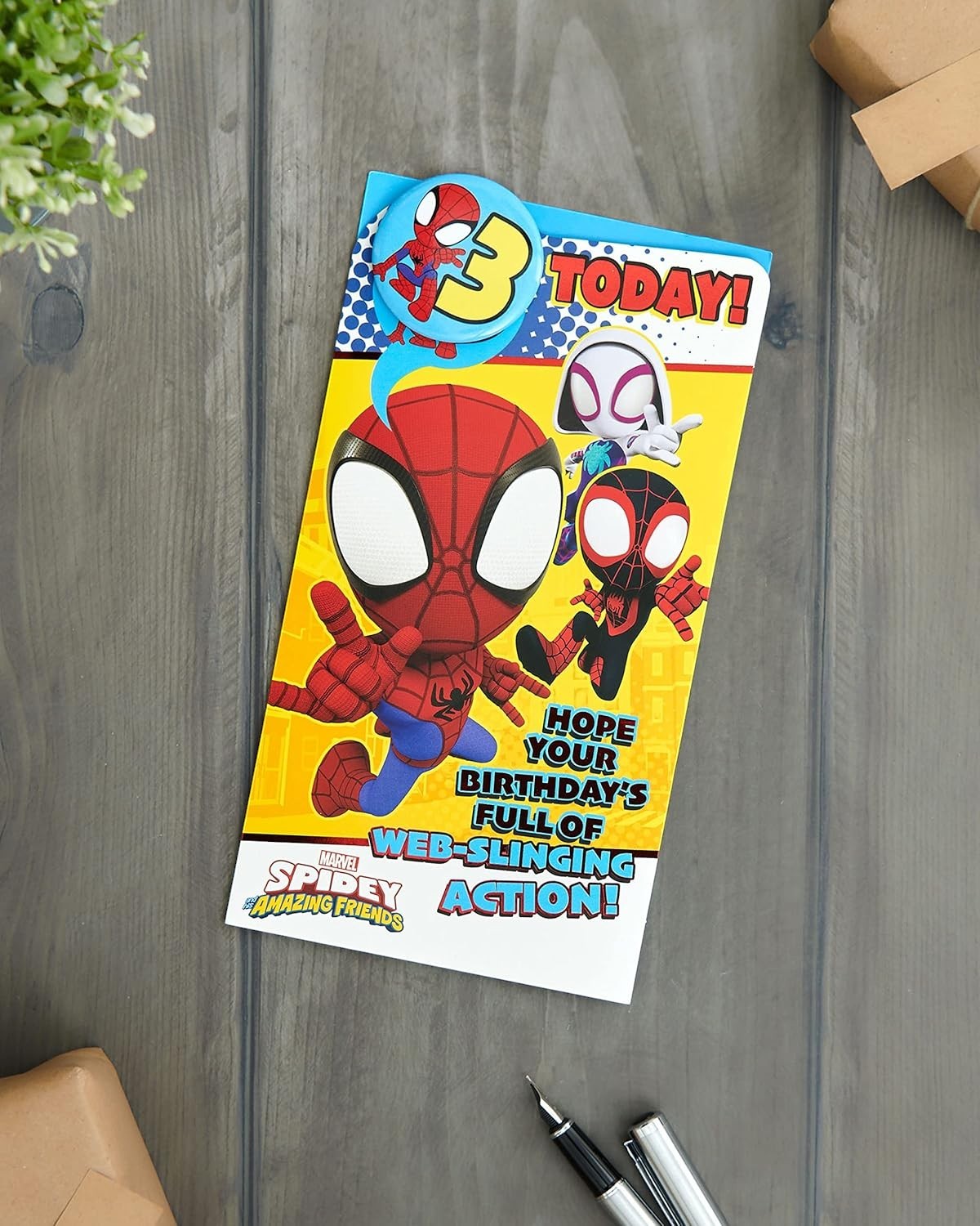 Made To Be Treasured 3rd birthday card featuring Spider-Man, Spider-Gwen, and Miles Morales in cartoon style. Front says "3 TODAY!" and "HOPE YOUR BIRTHDAY'S FULL OF WEB-SLINGING ACTION!"