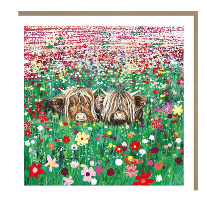 Made To Be Treasured Tracks Publishing blank greeting card featuring two Highland cows in a vibrant wildflower meadow.