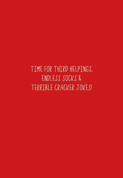 Inside red panel reading Time for third helpings, endless socks and terrible cracker jokes