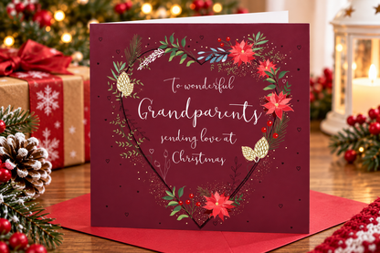 Otter House Grandparents Christmas card displayed with festive presents and lantern