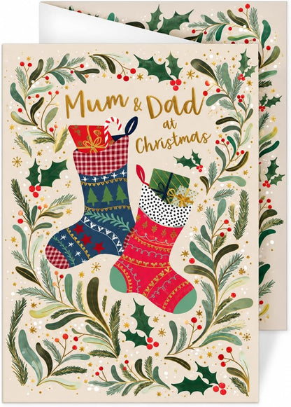 Mum and Dad at Christmas card by Otter House featuring two stockings, holly and gold lettering